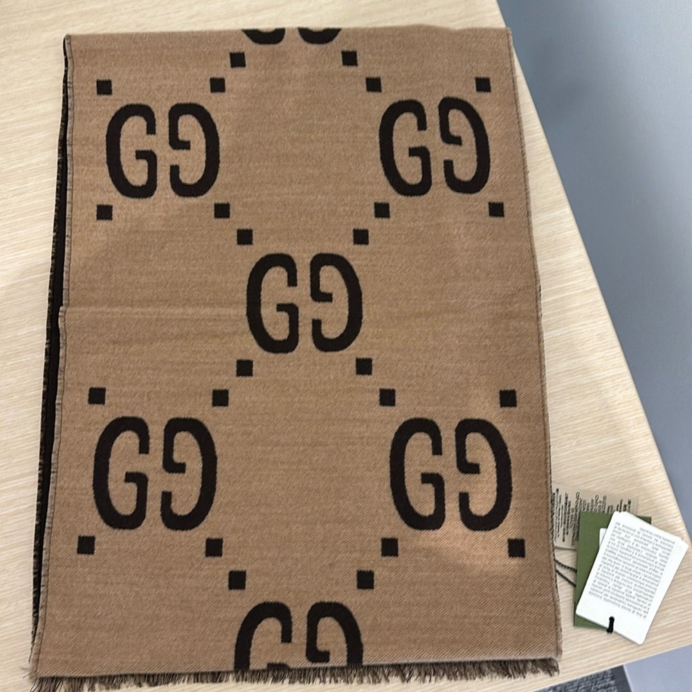Brand New Gucci scarf - tags on. Box is a little damaged.